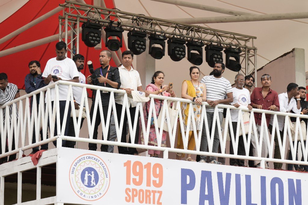 Suryakumar Yadav signing for a fan at a stadium event