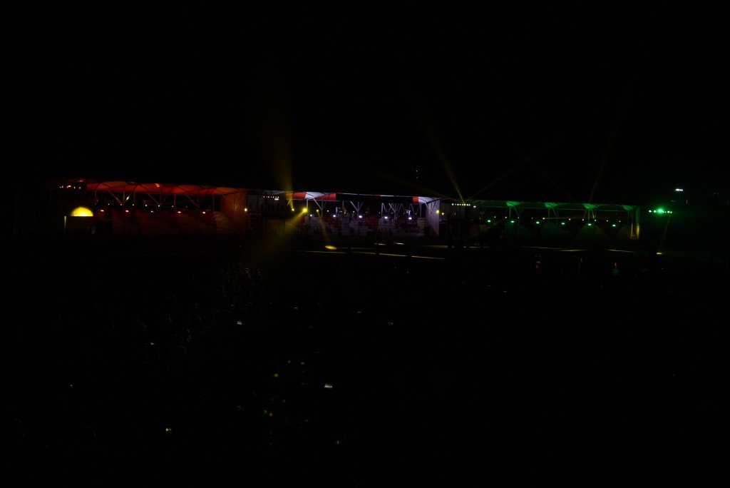 Officials on 1919 Sportz pavilion balcony with lighting rig